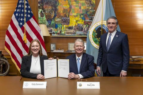 Executive Director Emily Domenech and Idaho Governor Brad Little signing MOU